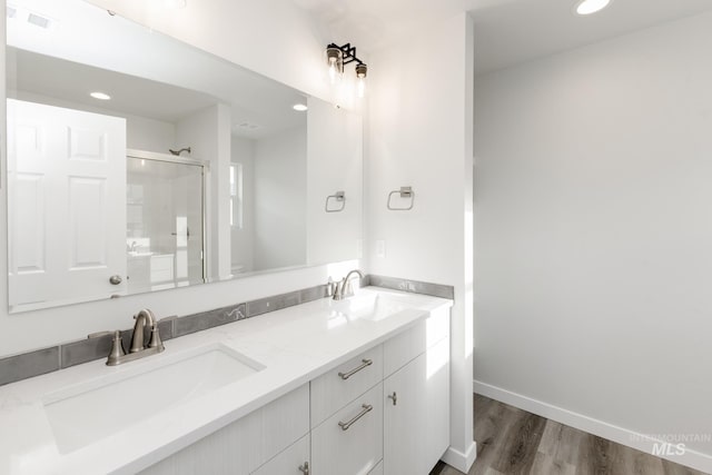 1396 W Malad River St, Meridian, ID 83642 - full bath featuring a shower stall, double vanity, a sink, and wood finished floors