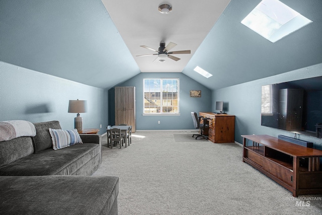 carpeted bedroom with lofted ceiling with skylight and ceiling fan