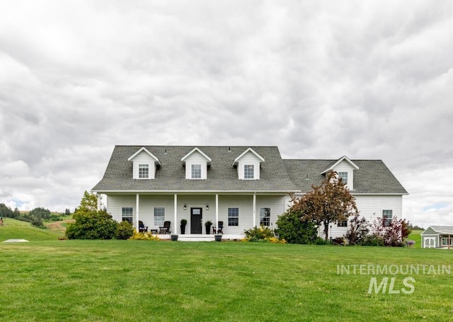 1027 Larkspur, Moscow, ID 83843 - cape cod-style house featuring a front lawn and a shingled roof