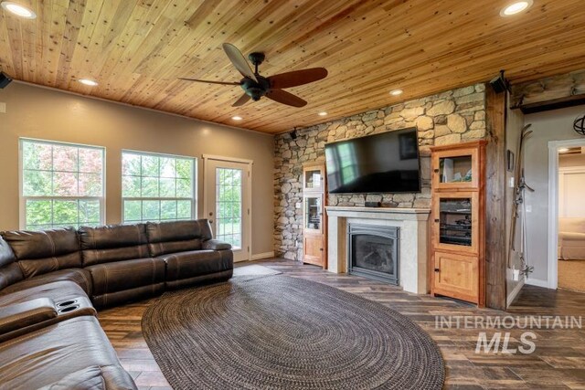1027 Larkspur, Moscow, ID 83843 - living area with wooden ceiling, a ceiling fan, a glass covered fireplace, dark wood-type flooring, and recessed lighting