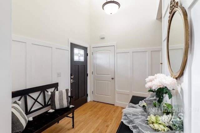 1027 Larkspur, Moscow, ID 83843 - foyer featuring a decorative wall, light wood-style flooring, and a wainscoted wall