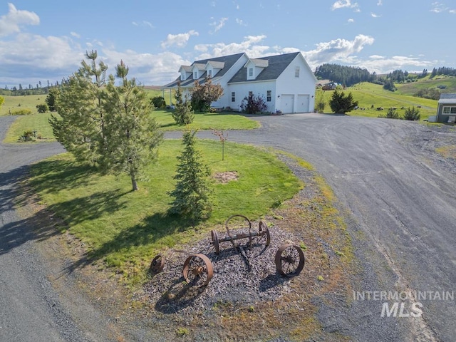 1027 Larkspur, Moscow, ID 83843 - view of front of home with a garage, a front lawn, and driveway
