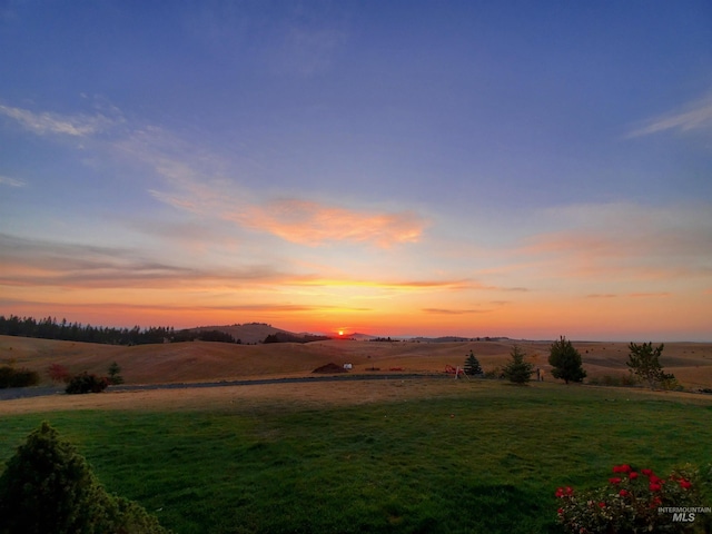 1027 Larkspur, Moscow, ID 83843 - yard at dusk featuring a view of rural / pastoral area and a lawn