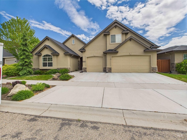 9389 W Wildbranch, Star, ID 83669 - traditional home featuring stone siding, stucco siding, and concrete driveway