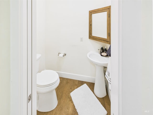 9389 W Wildbranch, Star, ID 83669 - bathroom featuring wood finished floors, baseboards, and toilet