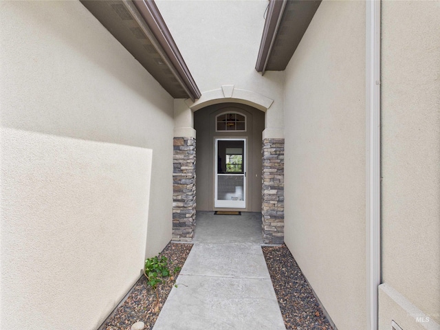 9389 W Wildbranch, Star, ID 83669 - doorway to property featuring stucco siding and stone siding