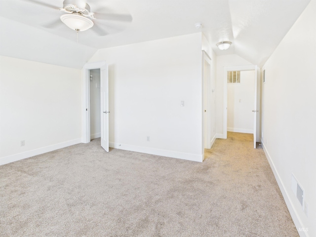 9389 W Wildbranch, Star, ID 83669 - unfurnished room with vaulted ceiling, light colored carpet, a ceiling fan, and baseboards