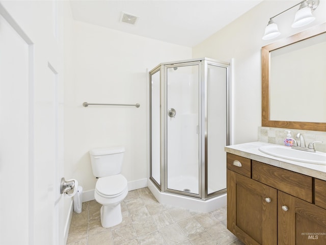 9389 W Wildbranch, Star, ID 83669 - bathroom featuring vanity, a shower stall, toilet, and tasteful backsplash