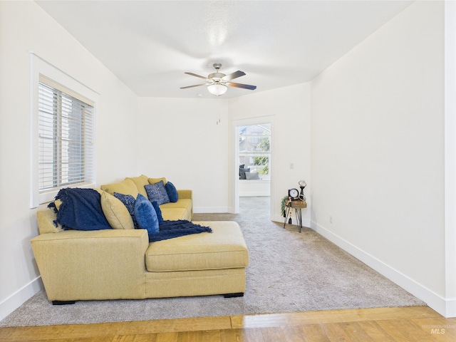 9389 W Wildbranch, Star, ID 83669 - carpeted living area featuring baseboards, ceiling fan, and wood finished floors