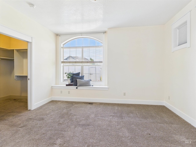 9389 W Wildbranch, Star, ID 83669 - unfurnished bedroom featuring carpet flooring, a spacious closet, and baseboards
