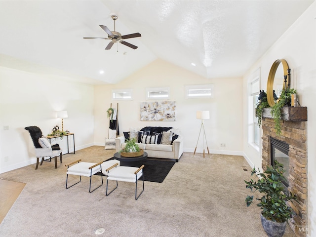 9389 W Wildbranch, Star, ID 83669 - carpeted living room with ceiling fan, vaulted ceiling, a stone fireplace, and baseboards