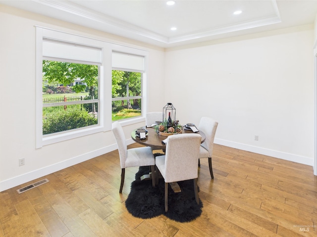 9389 W Wildbranch, Star, ID 83669 - dining room with ornamental molding, baseboards, light wood finished floors, a raised ceiling, and recessed lighting