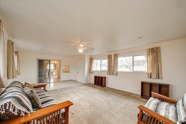 living room with light carpet, a ceiling fan, and radiator heating unit