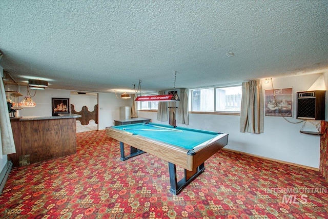 playroom with baseboards, a wall mounted air conditioner, carpet flooring, a textured ceiling, and billiards