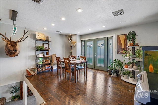 1011 Filer Ave W, Twin Falls, ID 83301 - dining area with recessed lighting, french doors, a textured ceiling, and wood finished floors