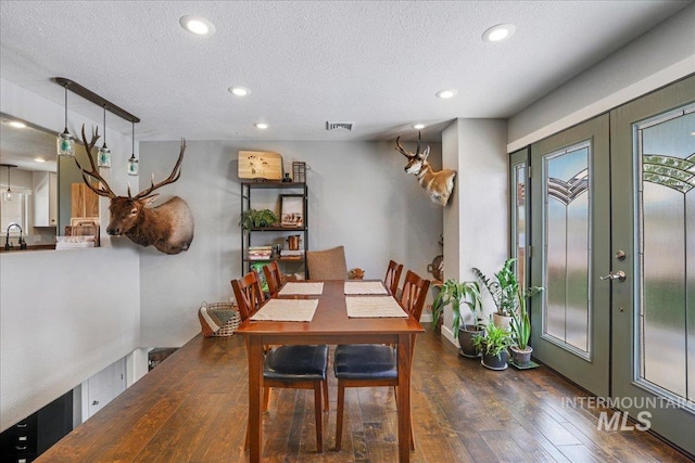 1011 Filer Ave W, Twin Falls, ID 83301 - dining room featuring hardwood / wood-style floors, recessed lighting, a textured ceiling, and french doors