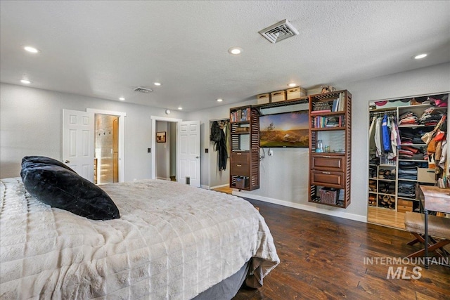 1011 Filer Ave W, Twin Falls, ID 83301 - bedroom with hardwood / wood-style floors, recessed lighting, a spacious closet, baseboards, and a closet