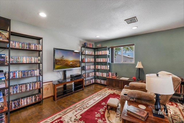 1011 Filer Ave W, Twin Falls, ID 83301 - living area with wood finished floors, a textured ceiling, and recessed lighting
