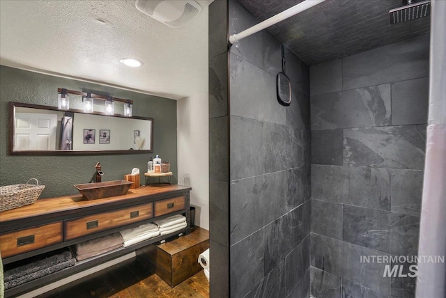 1011 Filer Ave W, Twin Falls, ID 83301 - bathroom with a tile shower and vanity