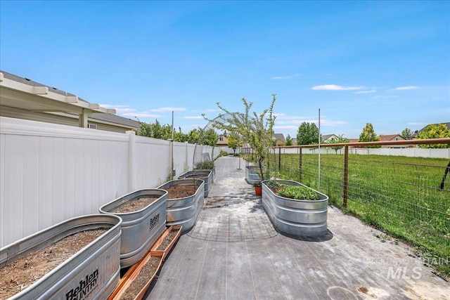 1011 Filer Ave W, Twin Falls, ID 83301 - fenced backyard featuring a patio