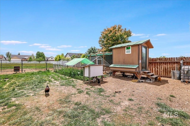 1011 Filer Ave W, Twin Falls, ID 83301 - fenced backyard with exterior structure and an outbuilding