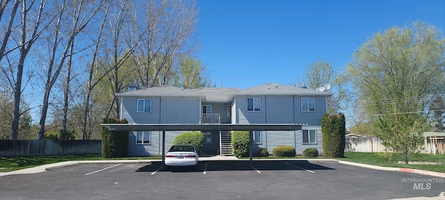9114 W Sigmont, Boise, ID 83709 - exterior space featuring stairway, covered and uncovered parking, and fence