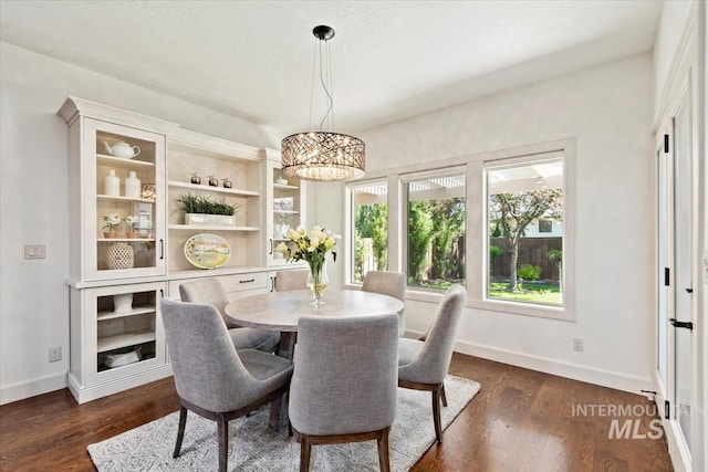 6964 N Moon Drummer Way, Meridian, ID 83646 - dining room featuring a chandelier, plenty of natural light, and baseboards