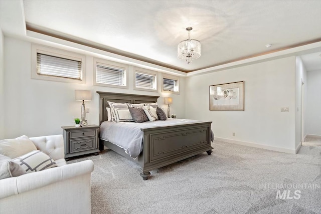 6964 N Moon Drummer Way, Meridian, ID 83646 - bedroom with a tray ceiling, a chandelier, light colored carpet, and baseboards