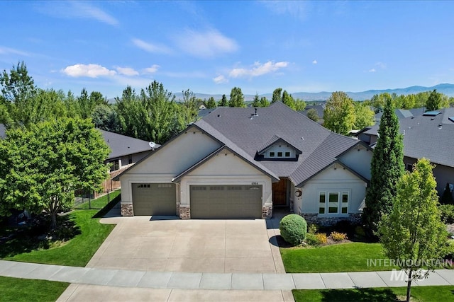 6964 N Moon Drummer Way, Meridian, ID 83646 - view of front facade with stone siding, a front lawn, an attached garage, and driveway