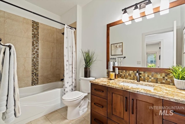 6964 N Moon Drummer Way, Meridian, ID 83646 - full bathroom featuring vanity, shower / bath combo, tile patterned flooring, toilet, and backsplash