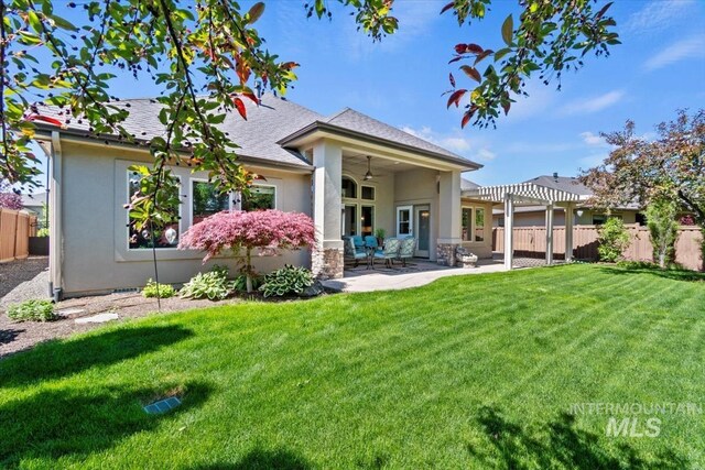 6964 N Moon Drummer Way, Meridian, ID 83646 - back of house featuring stucco siding, a pergola, ceiling fan, and a patio