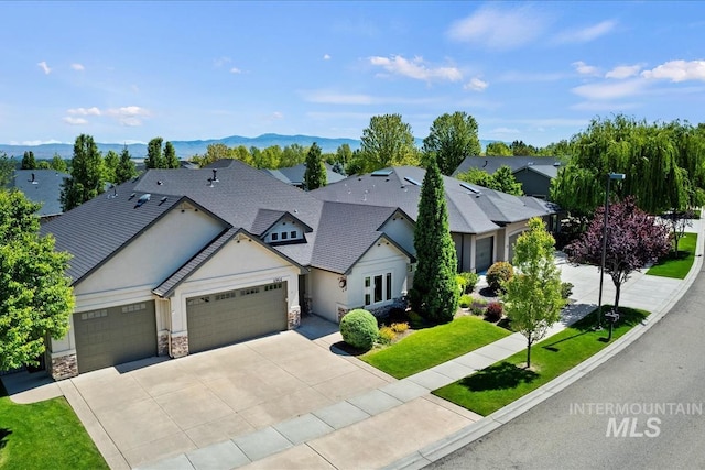 6964 N Moon Drummer Way, Meridian, ID 83646 - view of front of house featuring an attached garage, stone siding, concrete driveway, a front lawn, and a shingled roof
