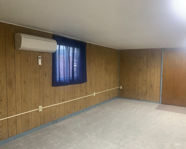 428 Orchard Dr, Gooding, ID 83330 - empty room with a wall unit AC, wood walls, and carpet floors
