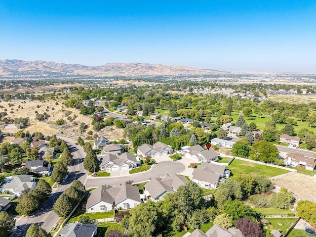 birds eye view of property with a mountain view