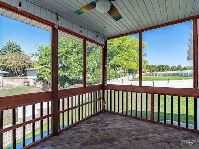 deck with ceiling fan and a lawn