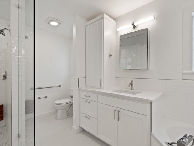 full bathroom featuring vanity, toilet, and separate shower and tub