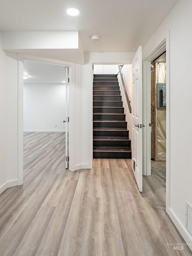 interior space featuring hardwood / wood-style floors and electric panel