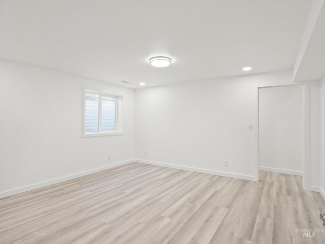 spare room featuring light hardwood / wood-style floors