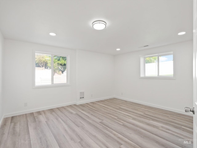 unfurnished room with light hardwood / wood-style flooring