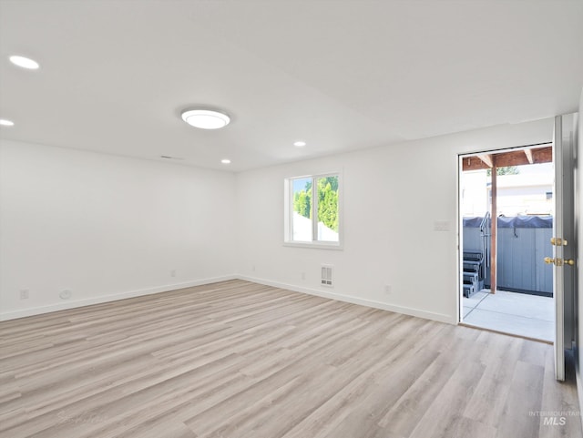 unfurnished room with light wood-type flooring