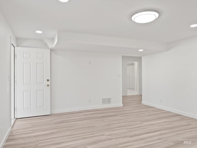 spare room featuring light hardwood / wood-style flooring