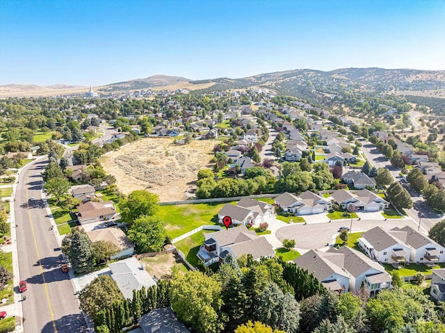 birds eye view of property featuring a mountain view