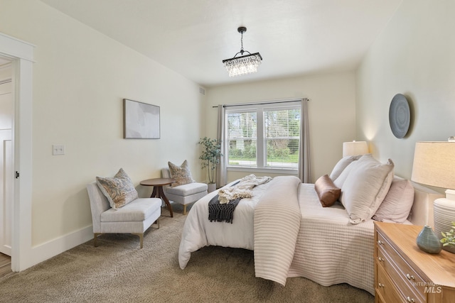 bedroom featuring baseboards and light colored carpet