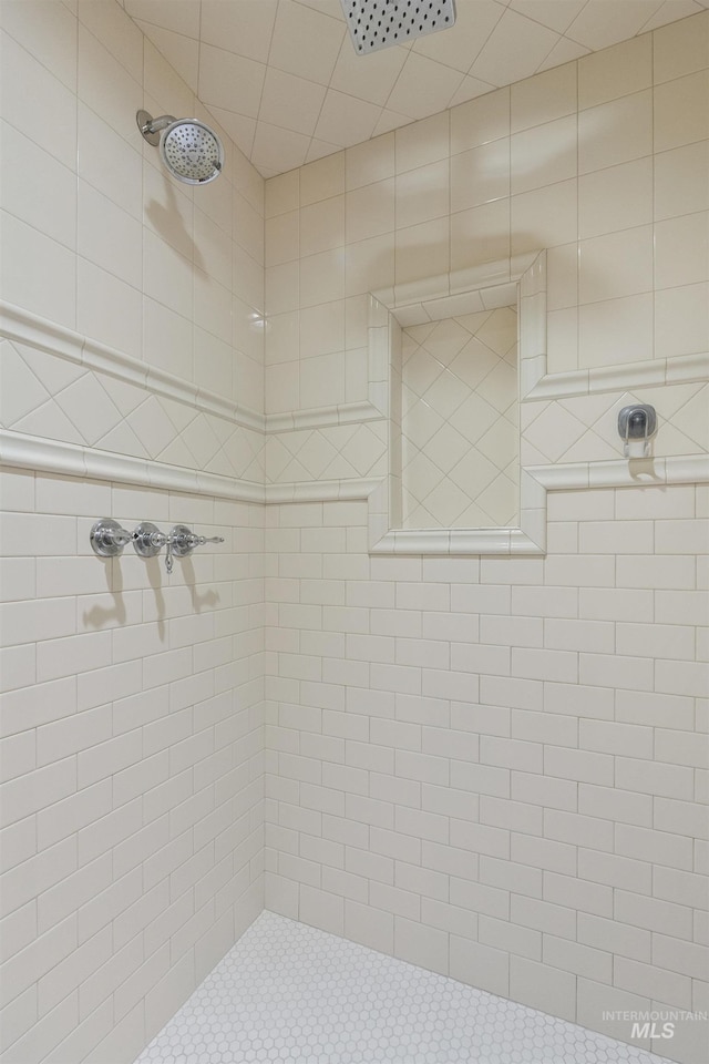 bathroom with tiled shower
