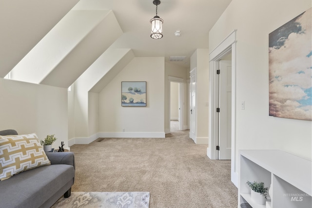 living area featuring visible vents, carpet flooring, baseboards, and vaulted ceiling