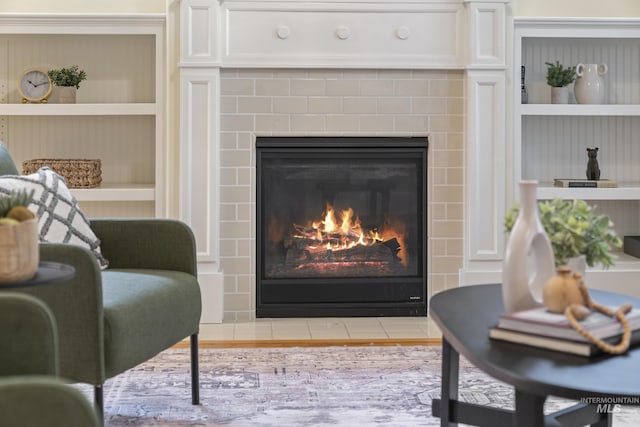 room details featuring built in features and a tile fireplace