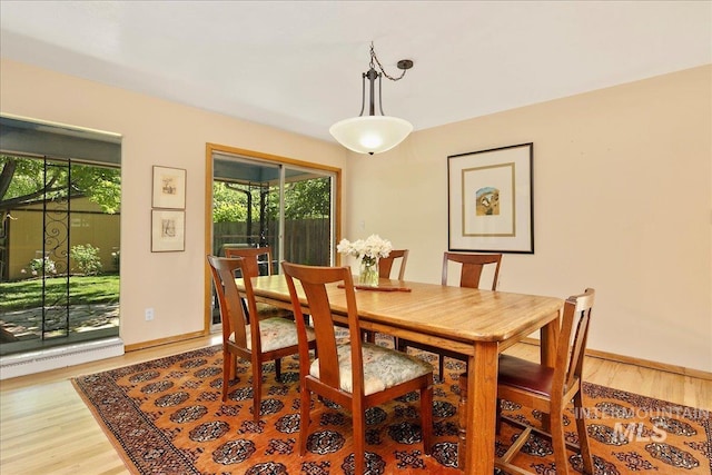 424 N Mobley Dr, Boise, ID 83712 - dining room with light wood finished floors, plenty of natural light, and baseboards