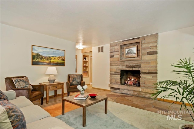 424 N Mobley Dr, Boise, ID 83712 - living area featuring a stone fireplace and baseboards