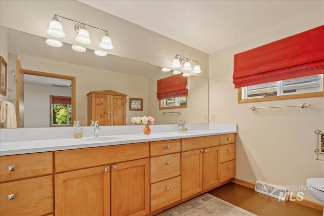 424 N Mobley Dr, Boise, ID 83712 - bathroom featuring double vanity and wood finished floors