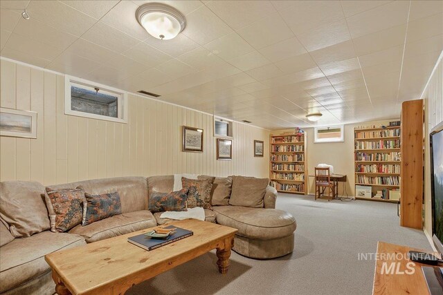 424 N Mobley Dr, Boise, ID 83712 - carpeted living area with built in shelves and wooden walls